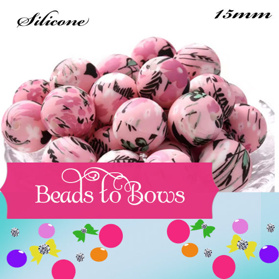 Pink silicone beads with floral patterns on a colorful background with 'Beads to Bows' branding.